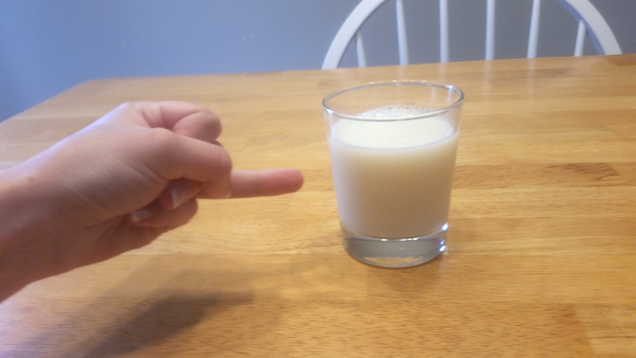 Illustration for article titled Astounding: 7 Incredible Photos Of Hands Pointing To Glasses Of Milk With Their Ring Fingers